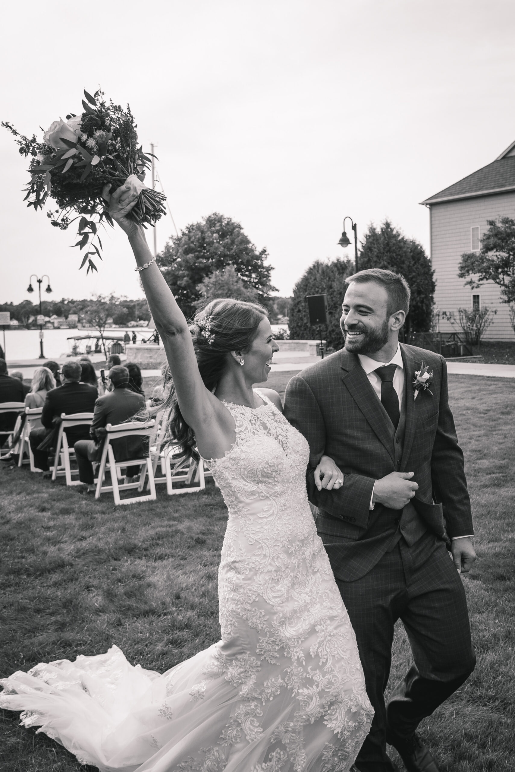 Wedding couple walking down the aisle celebrating in Door county