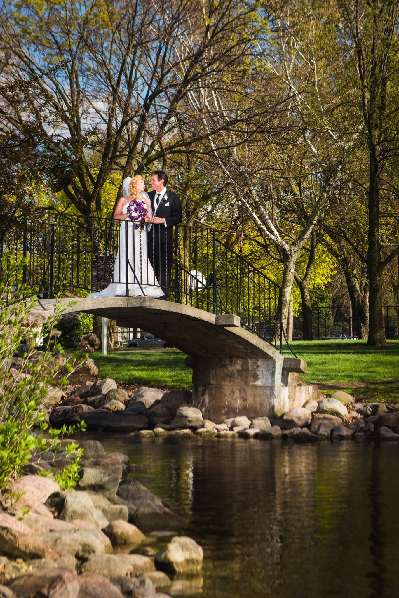 Fox Valley couple on a bridge after their wedding ceremony
