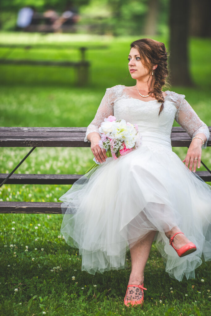 Bride sitting on a bench on her wedding day in Fox Valley Appleton