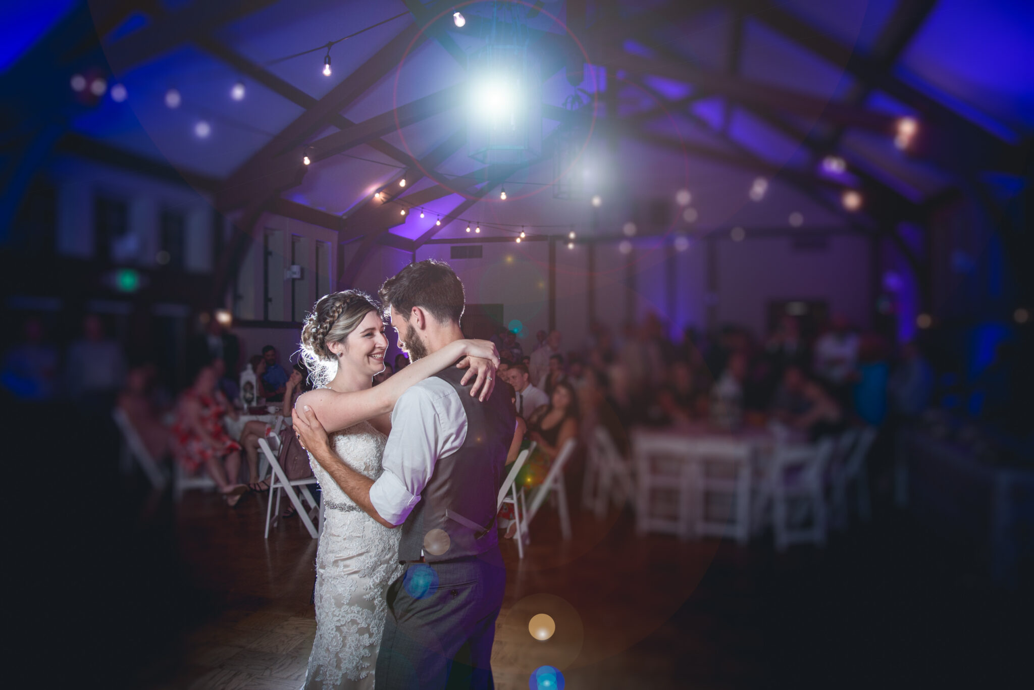couple dancing in a wedding venue after married during the first dance in lake geneva wisconsin