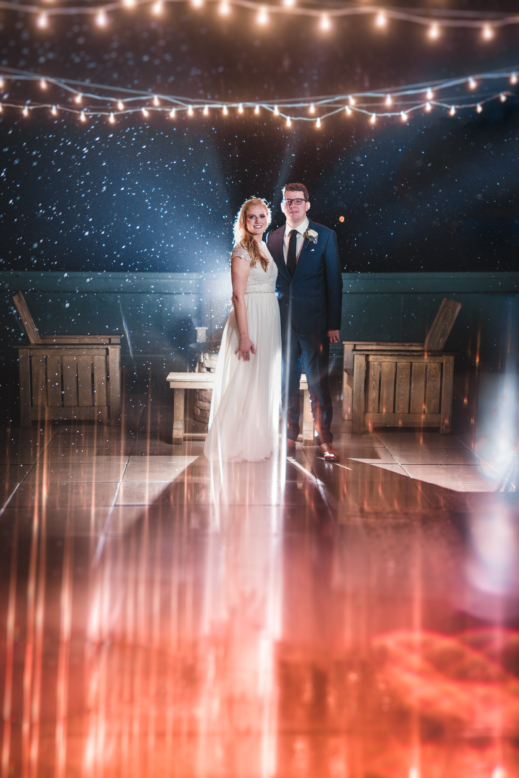 Creative and artistic take on a wedding couples photos after the ceremony in lake geneva wisconsin. there are lens flares