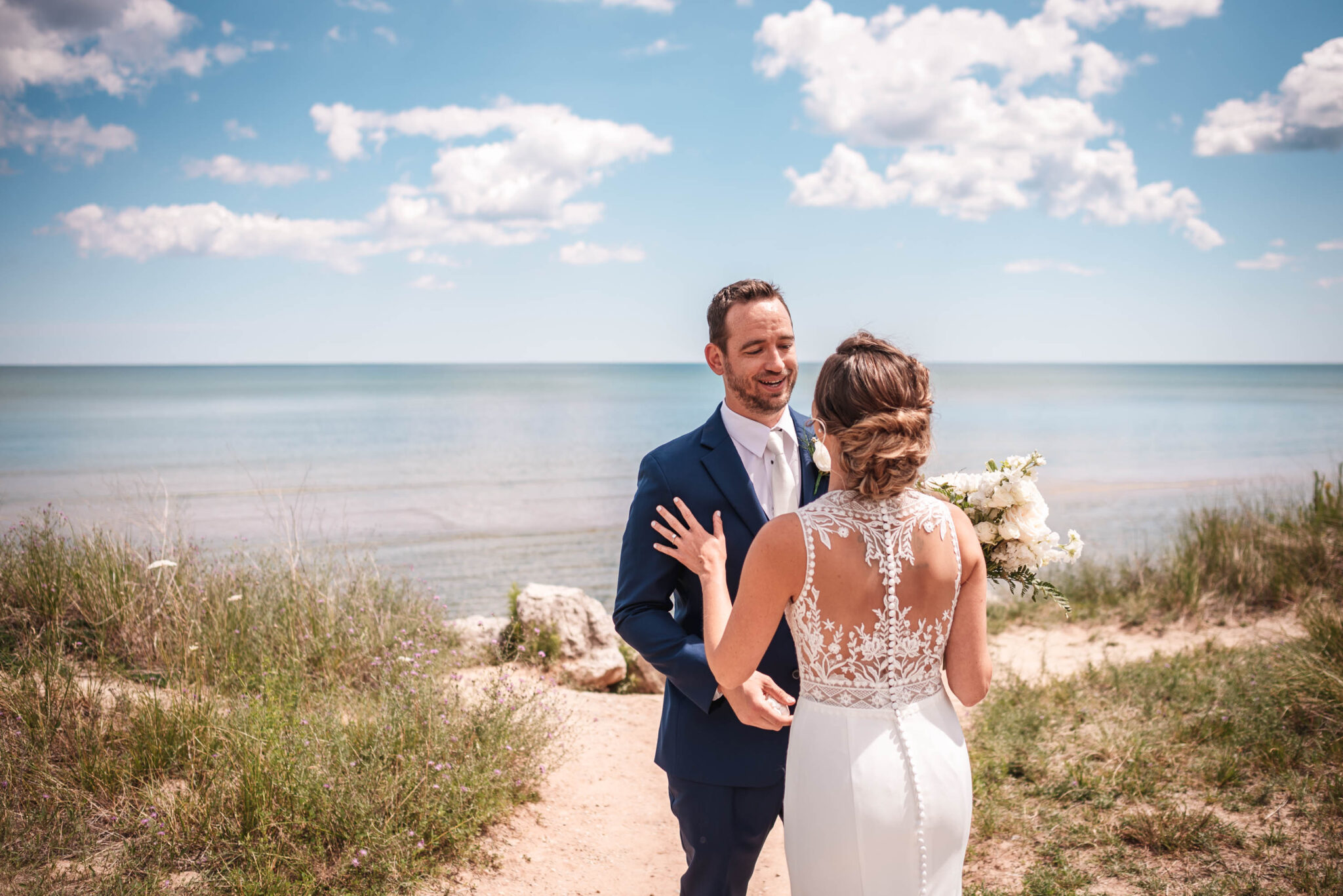 Sheboygan couple getting married on the beach of blue harbor.