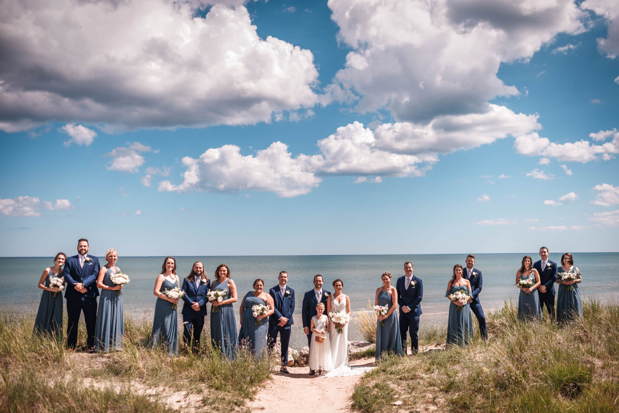 Greater wisconsin area wedding party on a beach on lake michigan
